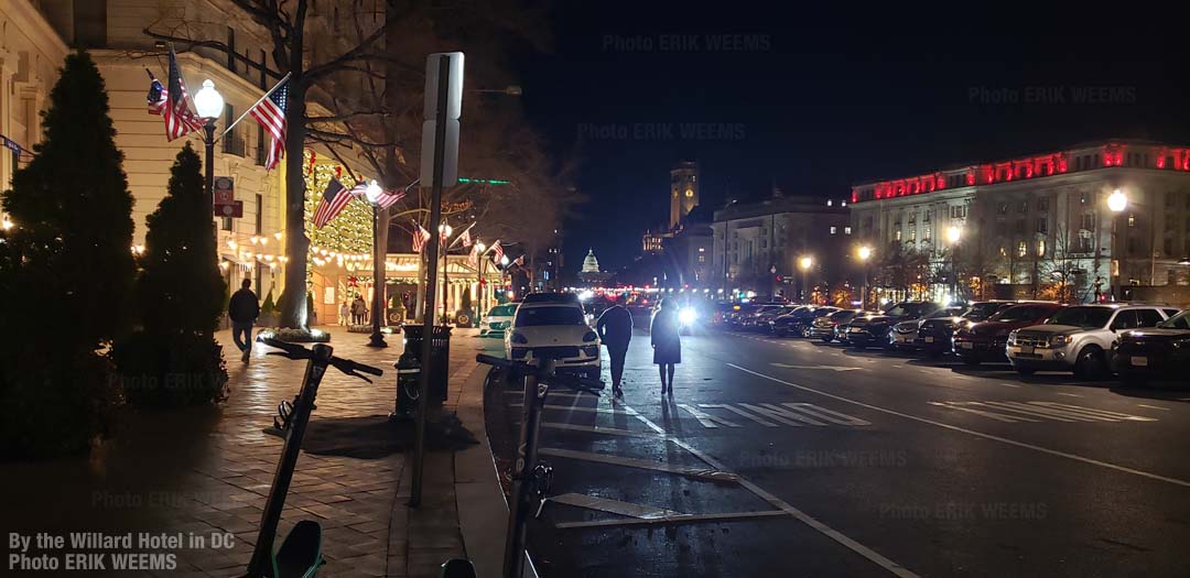 By the Willard Hotel in Washington DC with Capitol Dome in distance at night