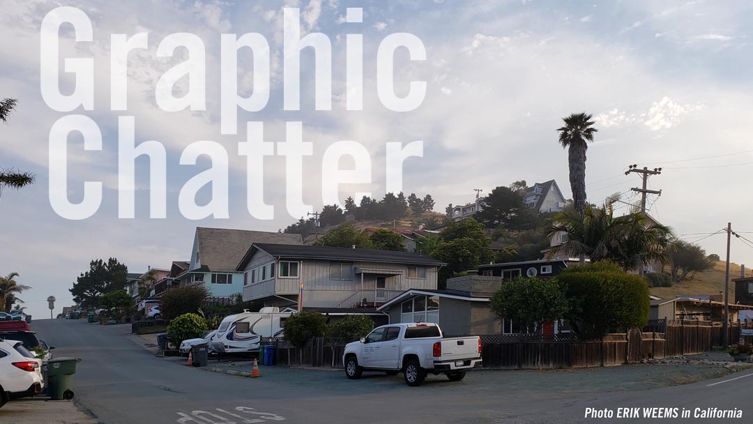 In California with houses and a tall palm